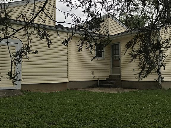 Patio off kitchen and attached outdoor shed