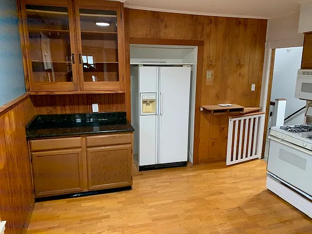 Kitchen. APPLIANCES WILL BE UPDATED and WALLS PAINTED WHITE before move in! Gate has been removed.