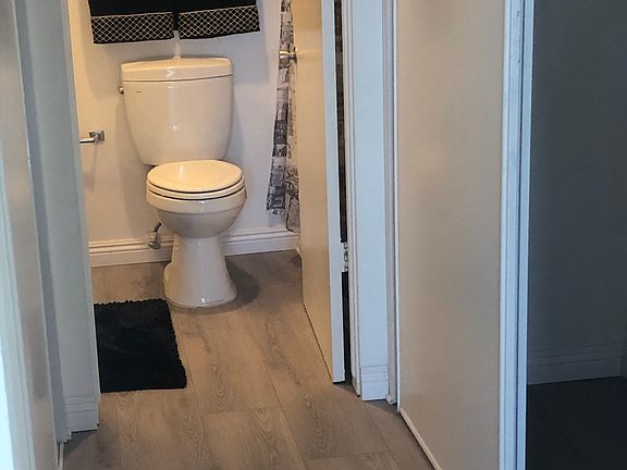 Hallway with closets on both sides