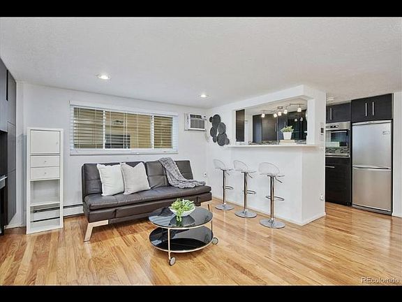 Gorgeous living space to include new engineered hardwood floors, European high wall shelves and cabinets across from the kitchen greet you at the entrance of your home. This space seems much larger/open than this image