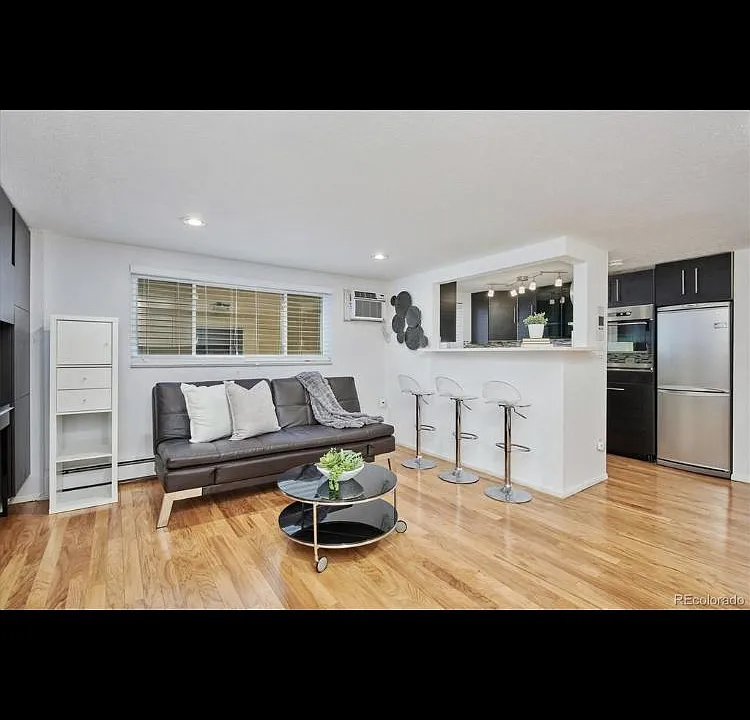 Gorgeous living space to include new engineered hardwood floors, European high wall shelves and cabinets across from the kitchen greet you at the entrance of your home. This space seems much larger/open than this image