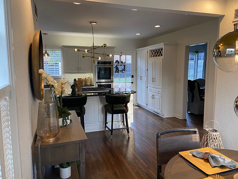 Open concept with newly refinished wood flooring