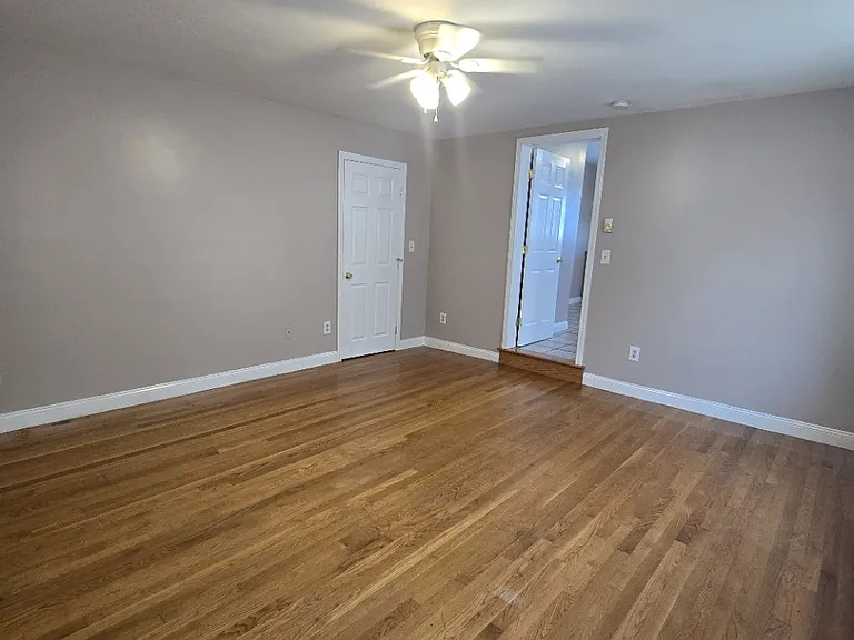 Front bedroom connected to kitchen. Closed door is closet
