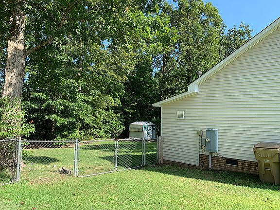 Fenced yard and storage shed
