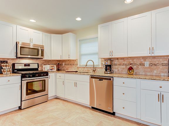 Wolfe cabinetry & level 2 granite countertops