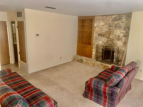 Large Living area that shows both a sofa and Love Seat.