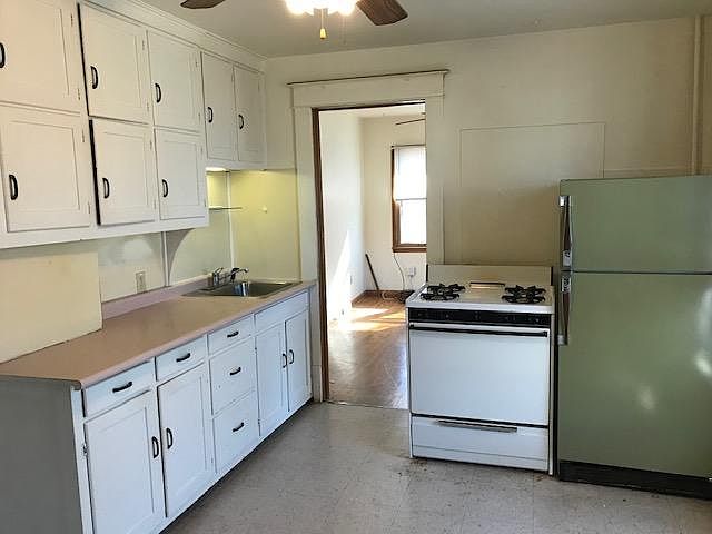 Kitchen with lots of counter space. Looking into bedroom off the kitchen.