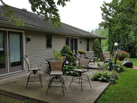 Back of house with two patios