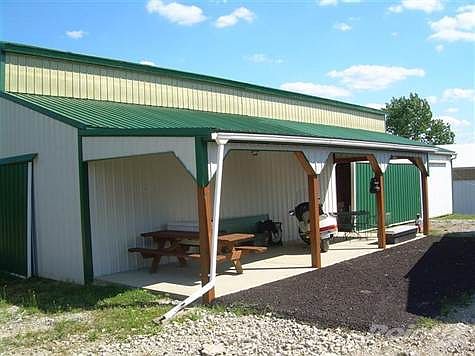 Covered Concrete Porch on front of 5 Stall Barn