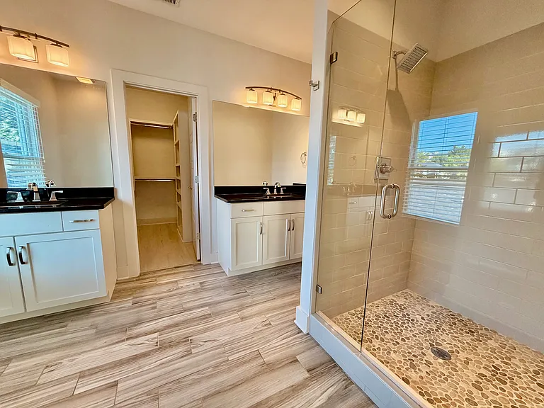 Large walk-in shower and double vanities