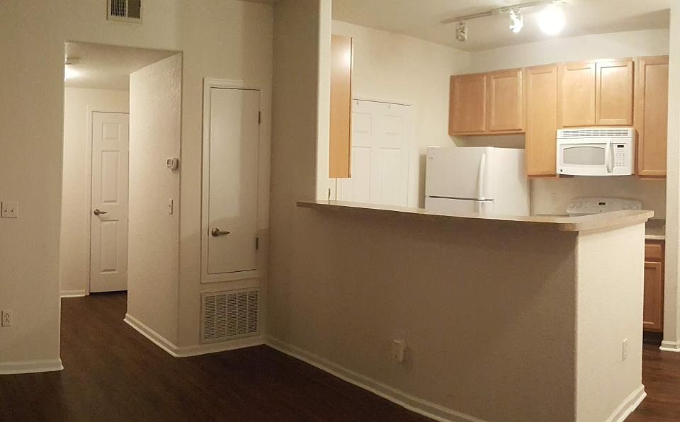 Open floor living room connected to kitchen and dining room