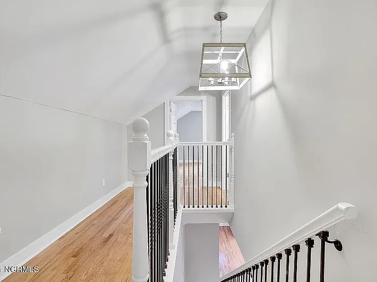 *original listing photo from when we purchased the home (upstairs hallway)