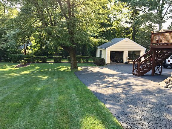 Lawn and detached garage