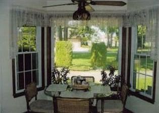 Charming dinette area wtile floor, SPECIAL pantry, and Anderson windows overlooking the beautiful fr