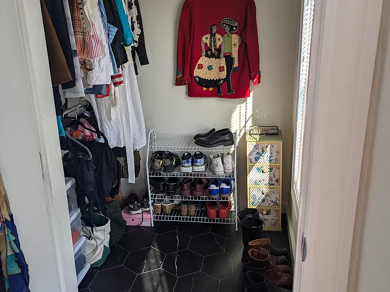 Master bedroom has a huge walk-in closet with a big window and plenty of storage.