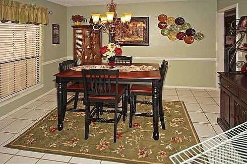 The formal dining is complete with warm neutral colors.