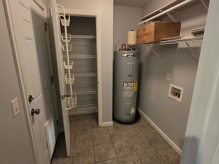 Pantry at the end of the kitchen, the side door goes to the back yard