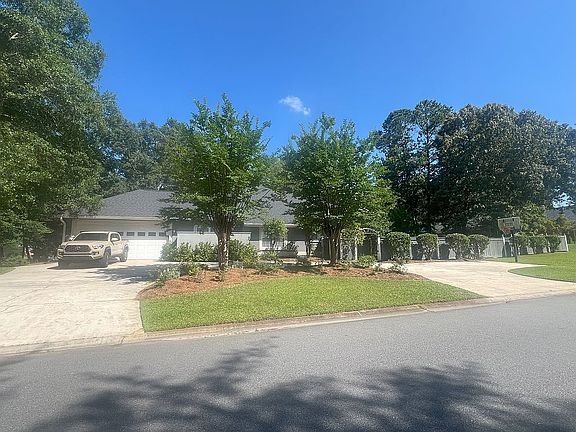 Side view w/garage & parking