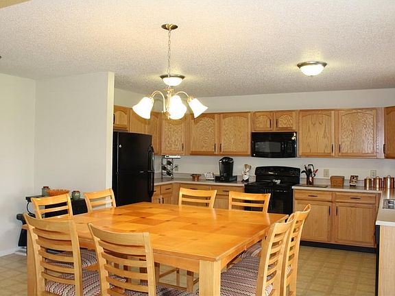 All appliances stay in this large kitchen.