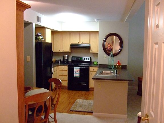 Kitchen opens to living room.