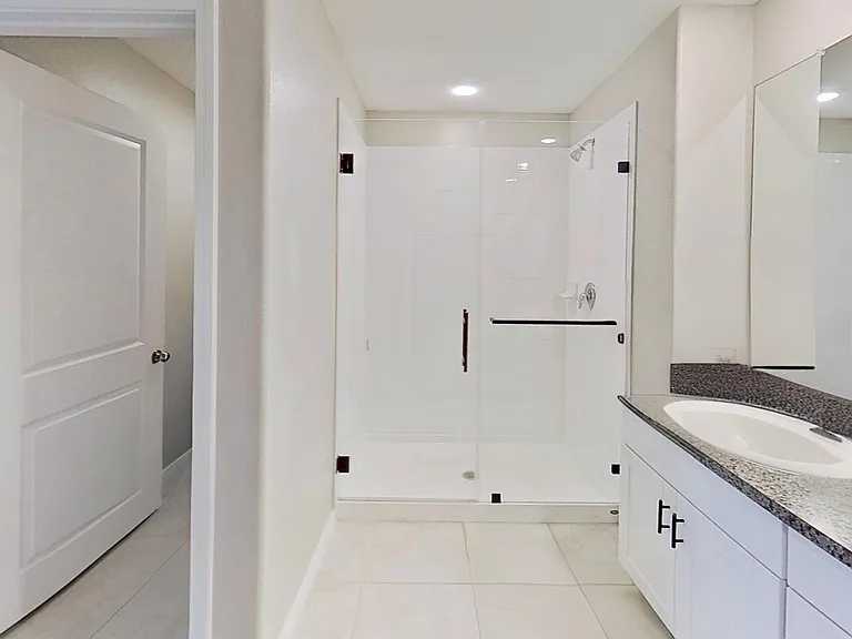 Spacious master bathroom with a walk-in closet.