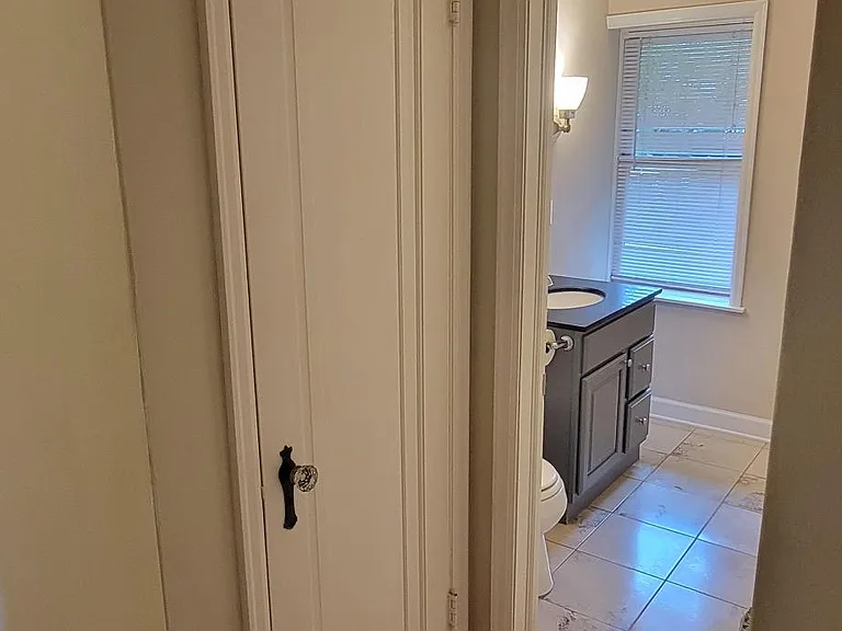 1 of 2 hall closets to main floor bathroom