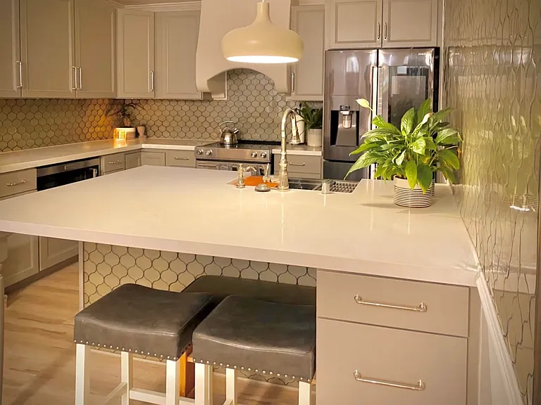 Recessed lighting and accent lighting to match your mood. Ample island bar seating for a shared experience with storage.