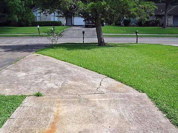 Extra concrete pad beside garage for more parking.