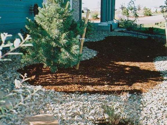 The wrap-around porch and view along the north side of the home.