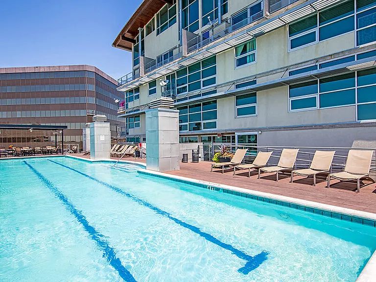 Olympic style swimming pool with sun loungers