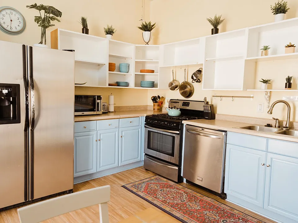 Spacious kitchen with a lot of storage and stainless steel appliances