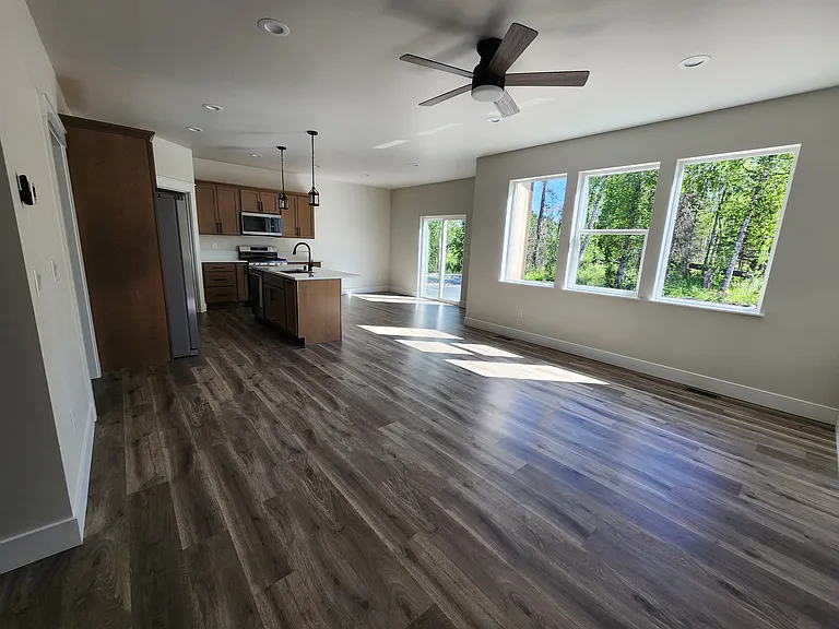 Open living/kitchen area with ceiling fan.