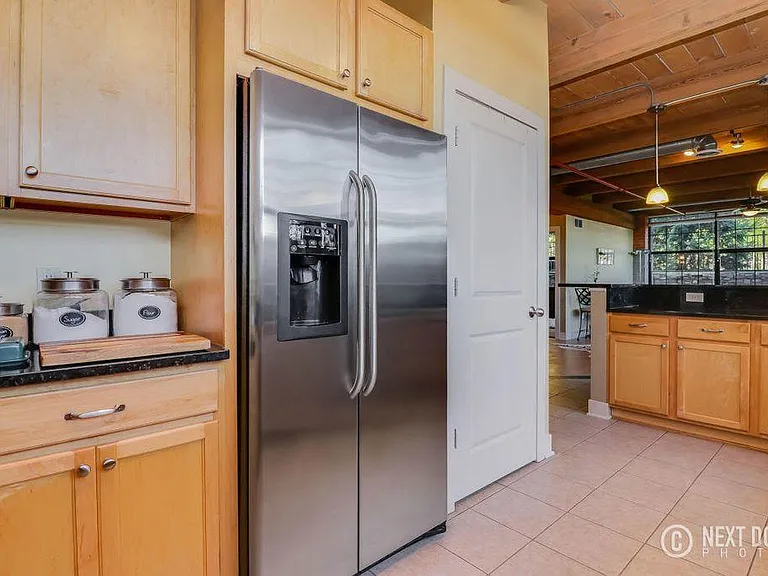Pantry to right of fridge and more cabinets