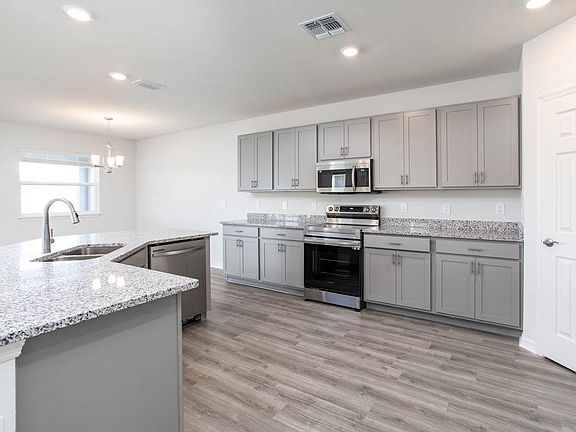 Your new kitchen wows with granite, 36-in. cabinets, Samsung appliances, and a walk-in pantry - New