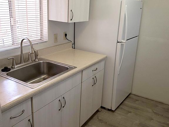 Refaced cabinets, new kitchen counters and new laminate flooring