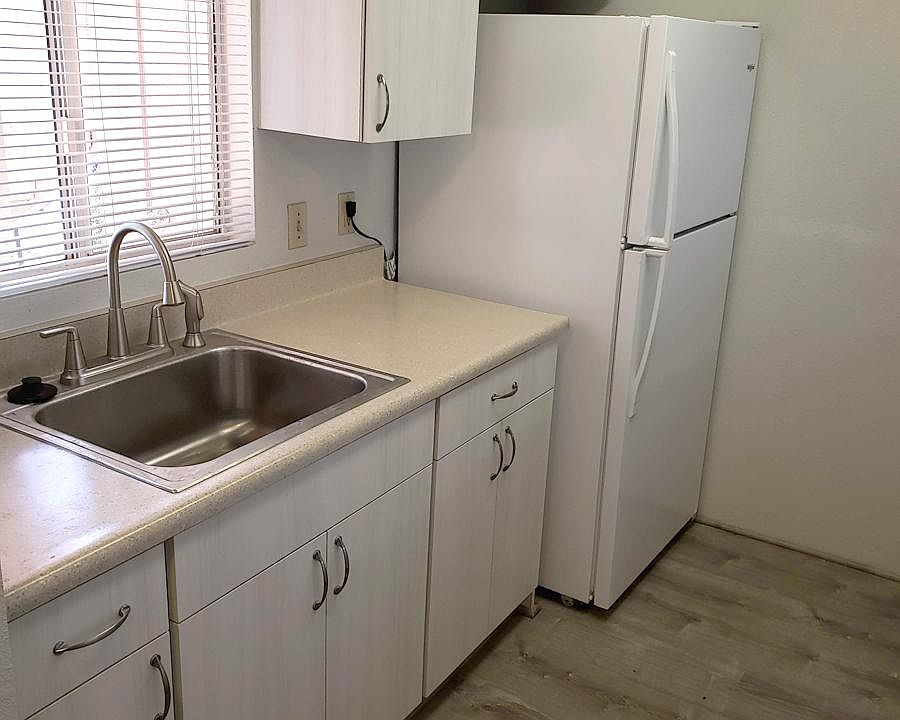 Refaced cabinets, new kitchen counters and new laminate flooring
