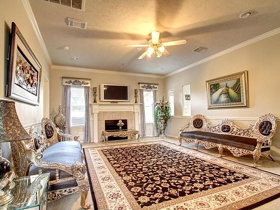 The family room is grand and features a fireplace.