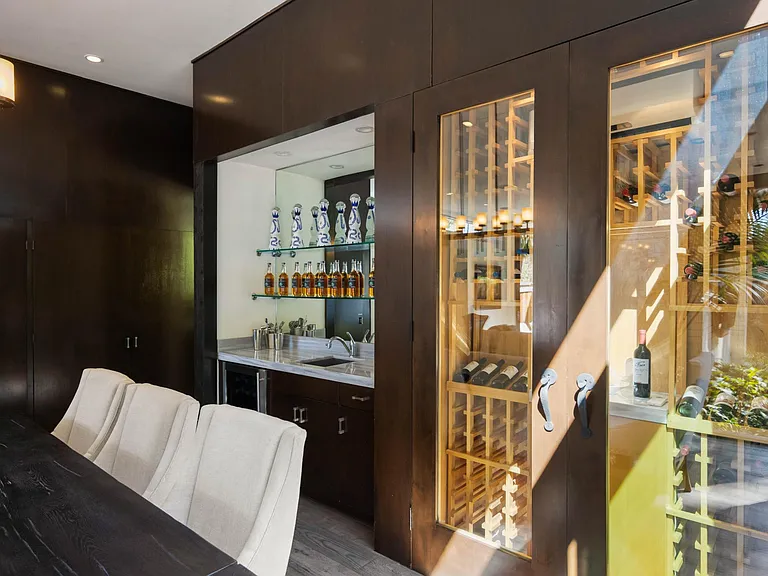 Explore the wine fridge, stocked with a variety of fine wines to enhance your dining experience .