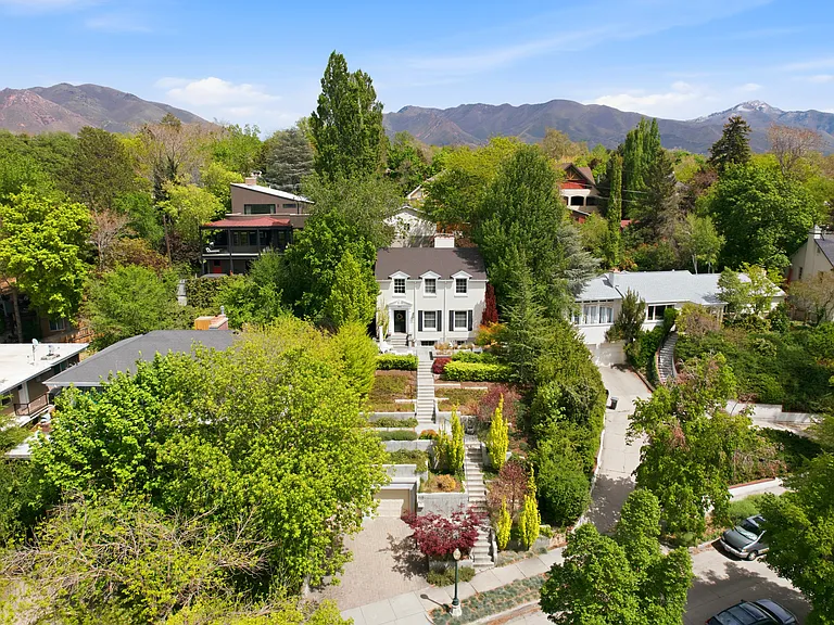 Front yard and beautiful landscaping of this lovely home set up on a hill. Charming and highly sought after Harvard - Yale neighborhood.