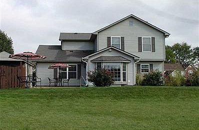 Sunroom overlooking beautiful inground pool