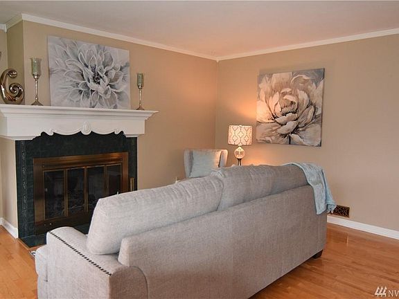 Living Room with Hardwood Floors & Classic Fireplace