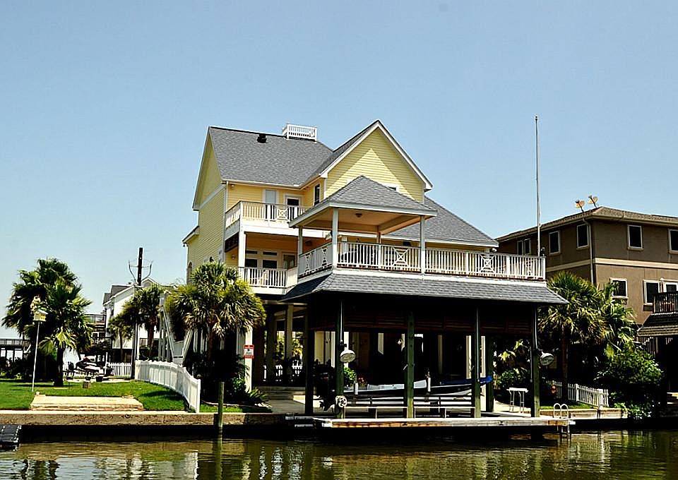 Two story home sitting on the canal with many patio and balcony views to enjoy the water views - bot