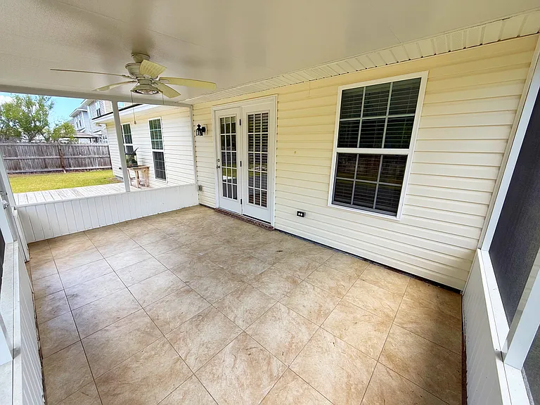 Screened back porch with tile floor