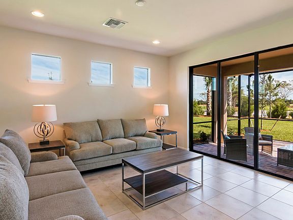 Open Gathering Room with access to the screened-in Lanai
