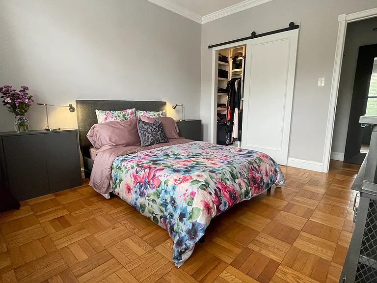 Bedroom and closet with built in shelvings for maximizing storage.