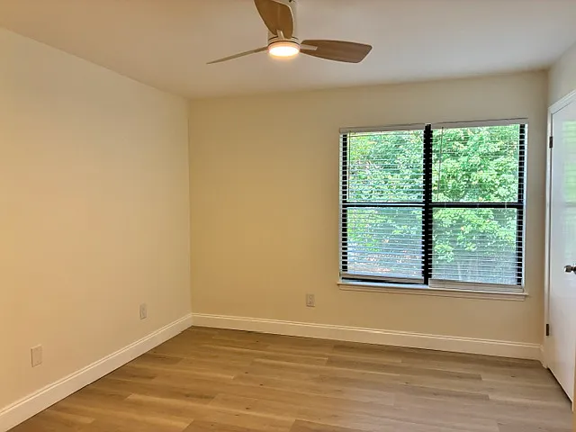 Master bedroom with walk in closet and a private bathroom