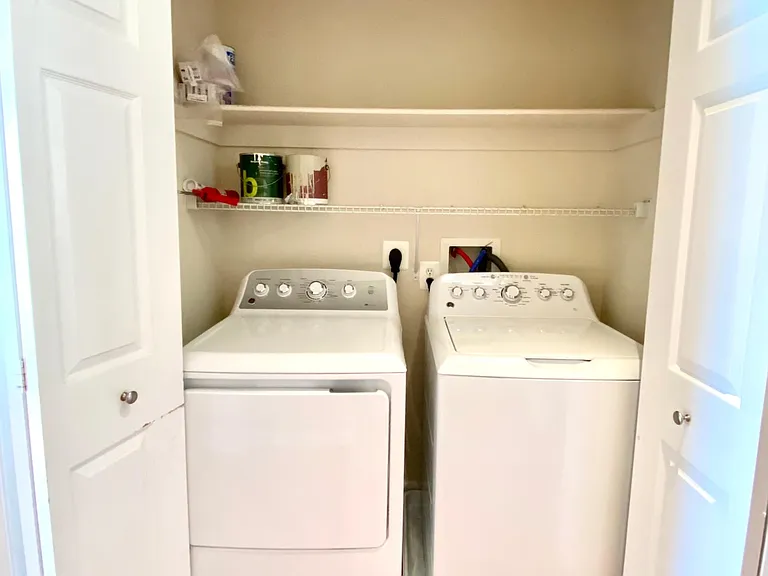 Washer/Dryer located upstairs with storage shelves. Washer and dryer just upgraded to Energy Star rated.