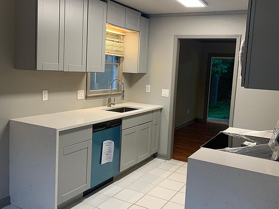 Brand new kitchen, quartz countertops with waterfall wrap, Samsung stainless appliances, chefs faucet and shaker cabinetry throughout