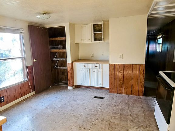 Kitchen has a nice sunny window and separate pantry area. Opening into hallway for the bedrooms and full bathroom.