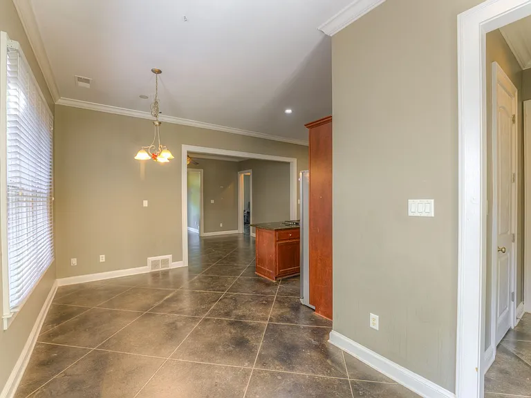 Dinning room next to kitchen. Right hall to laundry room and garage.